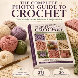 May include: A hardcover book titled The Complete Photo Guide to Crochet with a brown and white cover featuring various crochet stitch patterns and projects. Beside the book are several yarn balls in beige, pink, and green, and a metal crochet hook.