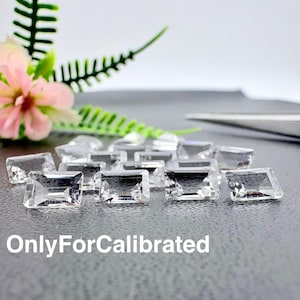 May include: A collection of clear, rectangular faceted gemstones arranged on a dark surface. The stones are transparent with sharp edges and a brilliant cut. The text OnlyForCalibrated is printed in white at the bottom of the image.
