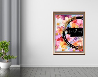 May include: A framed floral art print with a gold border. The artwork features a colorful arrangement of flowers in pink, orange, and white, with a black and gold circular design and the text "Love Yourself".