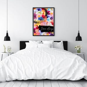 May include: A framed floral art print with a black border. The artwork features a vibrant mix of colorful flowers against a black and gold background. The words "Dream Always" are written in black script.