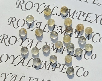 Naturalny złoty kwarc rutylowy w kształcie kaboszonu – okrągły kształt (różne rozmiary)