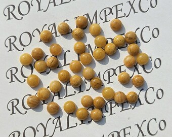Naturalny żółty awenturyn w kształcie kaboszonu – okrągły kształt, różne rozmiary
