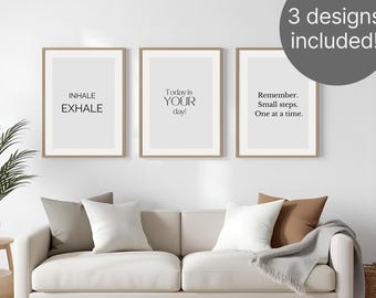 Puede incluir: Tres impresiones enmarcadas con citas inspiradoras: "INHALE EXHALE", "Today is YOUR day!", y "Remember. Small steps. One at a time." Las impresiones se exhiben sobre un sofá beige con cojines.