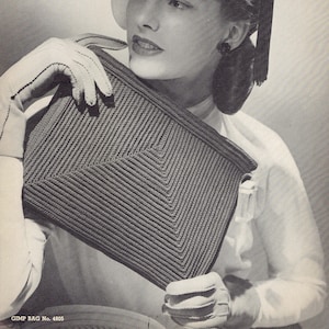 May include: A black and white photo of a woman wearing a white hat with a black bow and holding a woven handbag. The bag has a geometric pattern and is made of a textured material. The text "GIMP BAG No. 4805" is at the bottom of the image.