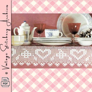 May include: A still life arrangement featuring vintage tableware. Includes a white teapot, teacups, plates, and wine glasses. The scene is set against a pink and white checkered background, with the text "Vintage Stitchery Archives" on the left side.