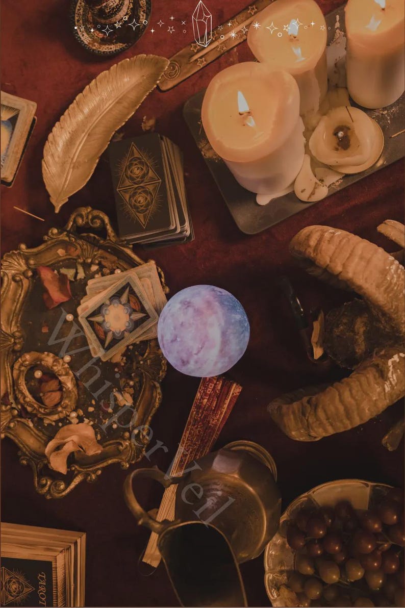 May include: A still-life composition featuring tarot cards, lit candles, and a decorative feather on a dark red surface. A crystal ball and a decorative frame are also present, creating a mystical ambiance. The image has a vintage aesthetic.