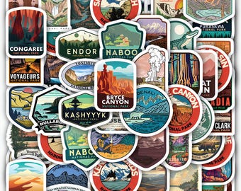 May include: A collection of colorful stickers featuring national park designs. The stickers showcase various landscapes, including mountains, canyons, and waterfalls. Each sticker has a unique shape and design, with text indicating the park name.