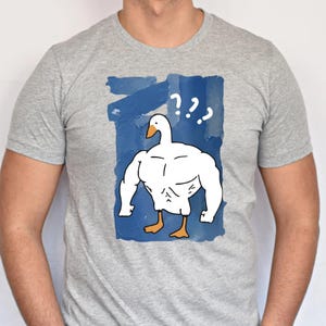 May include: A set of three ceramic nesting bowls in shades of blue, green, and white. The bowls feature a speckled glaze and a simple, modern design. The largest bowl is approximately 7 inches in diameter.