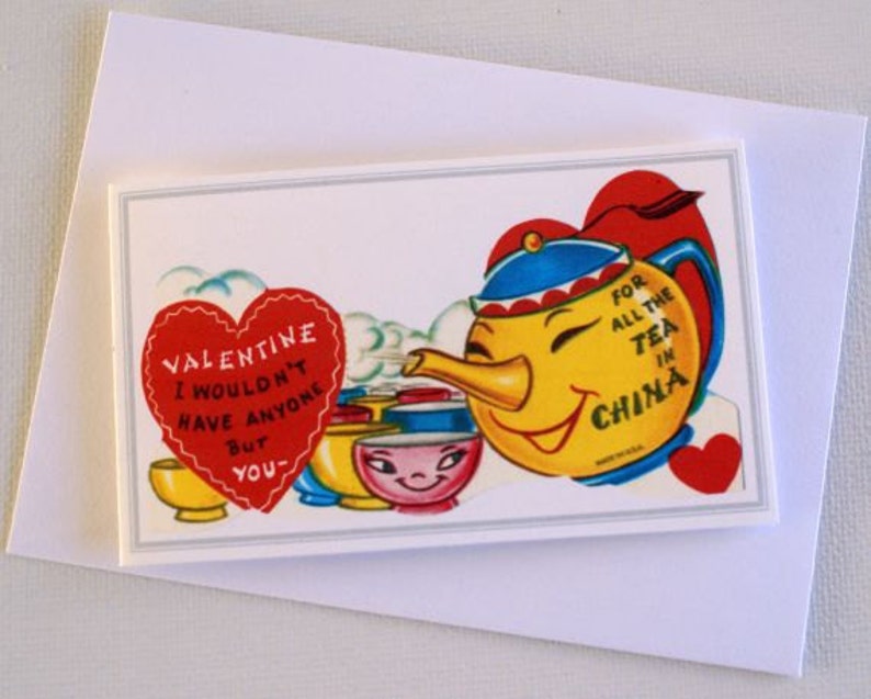May include: A vintage Valentine's Day card with a smiling yellow teapot wearing a blue and red hat, and the text "FOR ALL THE TEA IN CHINA." A red heart with the text "VALENTINE I WOULDN'T HAVE ANYONE BUT YOU" is also present.