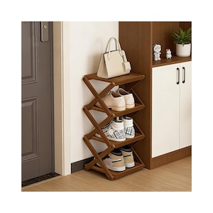 May include: A wooden shoe rack with four shelves, holding various pairs of shoes and a beige handbag. The rack has an accordion-style design and is positioned against a wall next to a cabinet. The shoes include sneakers and loafers.