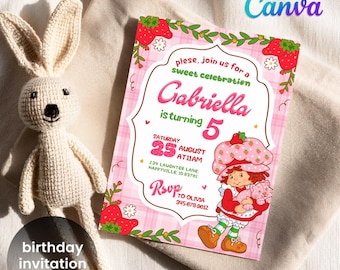 May include: A birthday invitation with a pink plaid background, featuring a Strawberry Shortcake character. The invitation reads "Gabriella is turning 5" and includes event details. A crocheted bunny doll is next to the invitation.