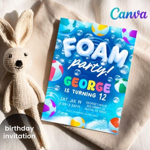 May include: A birthday invitation with a blue background and the words "FOAM party!" in white, and "GEORGE IS TURNING 12" in colorful letters. The invitation features beach balls and bubbles. A crocheted bunny toy is next to the invitation.
