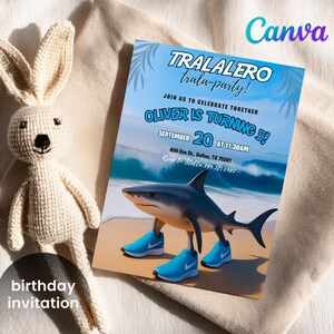 May include: A birthday invitation with the text "TRALALERO trala-party!" and "OLIVER IS TURNING 5!" featuring a shark wearing blue sneakers on a beach. A crocheted bunny is next to the invitation. The invitation is for September 20 at 11:30 AM.