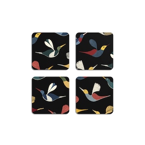 May include: Four square coasters with a black background, each featuring a repeating pattern of colourful birds. The birds have red, yellow, blue, and white details. The coasters are likely made of a durable material.
