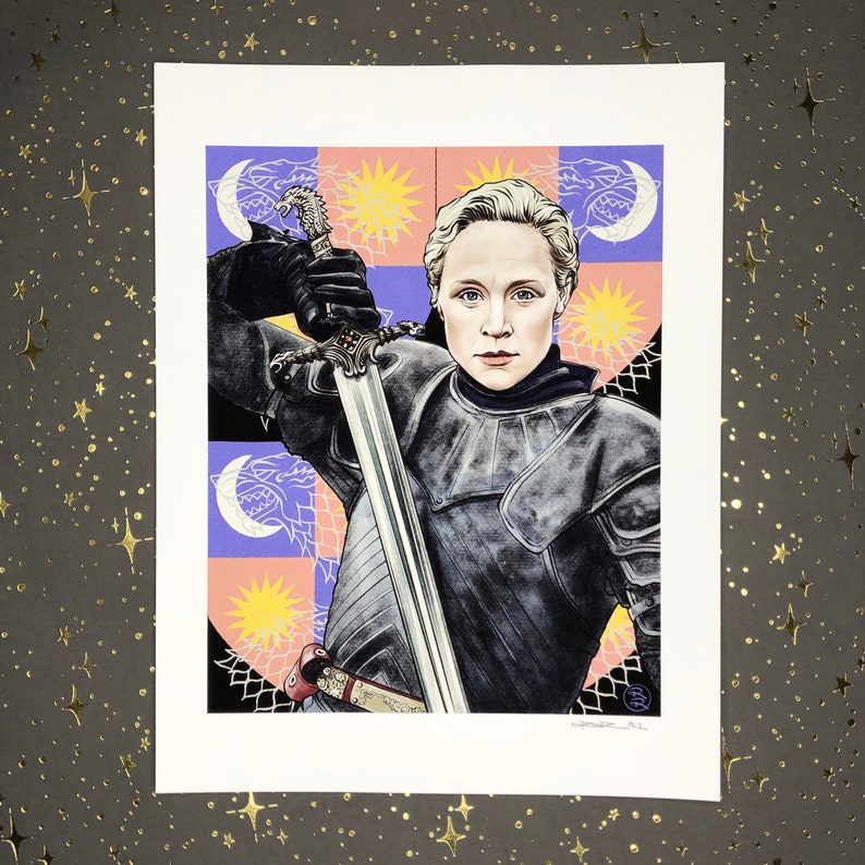 May include: A woman in armor holds a sword in front of a colorful background with a pattern of suns, moons, and wolves. The background is a light purple, pink, and yellow.