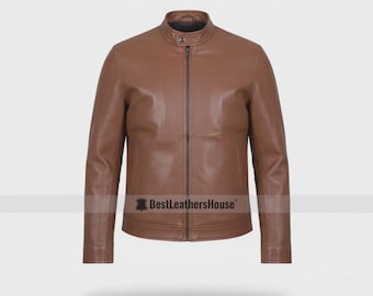 May include: A brown leather jacket with a stand-up collar and a full-length zipper. The jacket has long sleeves and a tailored fit. The brand name "BestLeatherHouse" is visible at the bottom of the jacket.