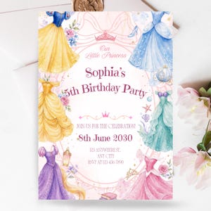May include: A rectangular birthday party invitation card featuring watercolor illustrations of five colorful princess dresses, a carriage, and a crown. The text reads: Our Little Princess, Sophia's 5th Birthday Party, JOIN US FOR THE CELEBRATION!, 8th June 2030, 123 ANYWHERE ST. ANY CITY, RSVP AT 123 456-7890.