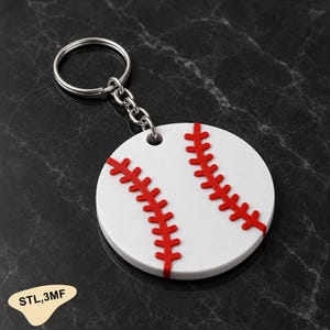 May include: A circular white keychain featuring a raised red baseball stitch pattern across the center. The keychain includes a silver metal split ring attached by a short chain. The text STL,3MF is printed in black on a small tan shape.