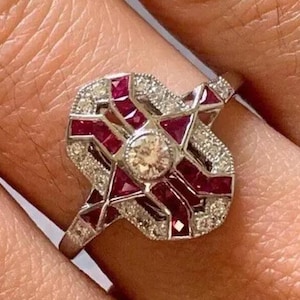 May include: A rustic wooden sign with the text "Welcome to our home" in white lettering. The sign has a distressed finish and a simple, inviting design, ideal for entryway decor.