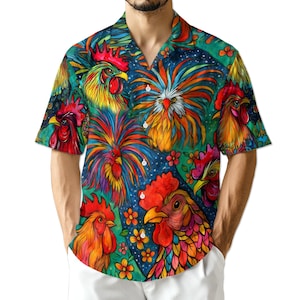 May include: Short-sleeved button-down shirt featuring a vibrant, colorful rooster pattern. The design includes multiple rooster illustrations in shades of red, yellow, orange, and blue, set against a teal background with small flowers. The shirt has a classic collar and a relaxed fit.