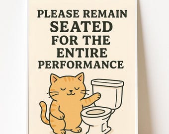 May include: A framed print featuring a cartoon cat and a toilet. The orange tabby cat is smiling and pointing at the toilet. The text at the top reads "PLEASE REMAIN SEATED FOR THE ENTIRE PERFORMANCE."