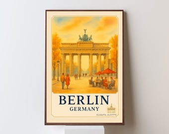 May include: A framed print of the Brandenburg Gate in Berlin, Germany. The image shows the gate with a warm colour scheme, figures strolling, and a cafe scene. The text "BERLIN GERMANY" is displayed at the bottom of the print.