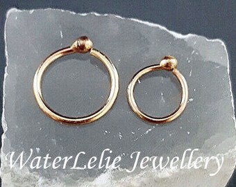Solid 10k Gold nose ring. 18 gauge 10k gold earrings. Solid 10k nose ring. One ring. Second hole ring. Solid gold ball earrings. WaterLelie