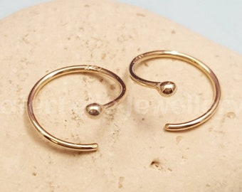 Solid gold Spiral Huggie Earrings. 14k Gold spiral hoops. 14k gold huggie earrings. Solid gold earrings. 14k gold hoops. Rose gold hugger