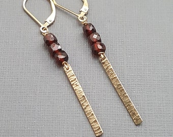 Garnet and gold earrings. Long dangles. Garnet jewelry. January birthstone. Lever back. Gifts for her. Hammered gold earrings.