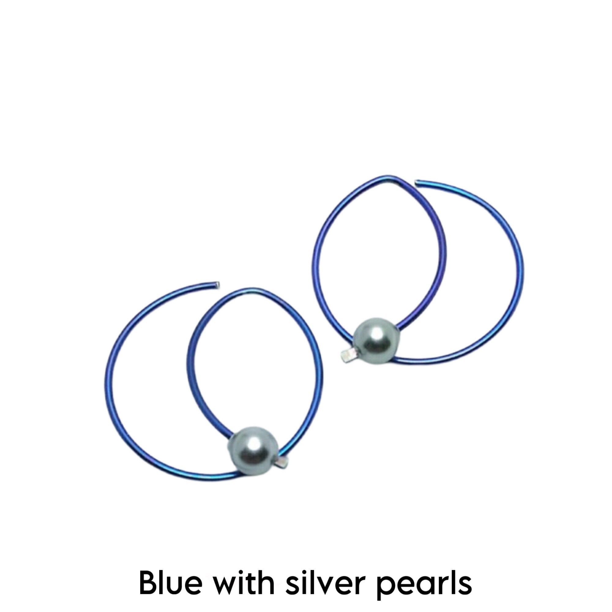 Niobium Hoops. small niobium earrings. niobium modern hoops. Niobium jewelry. Geometric hoops. Blue earrings. Purple earrings.