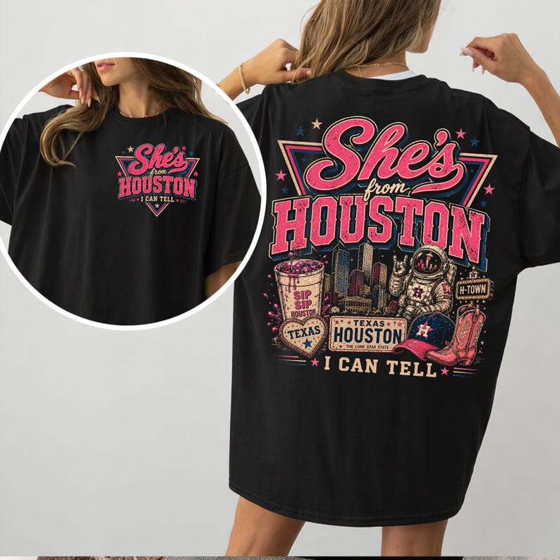 May include: A black t-shirt featuring a graphic design with the text She's from HOUSTON I CAN TELL. The back print includes a Houston skyline, an astronaut, a cowboy boot, a baseball cap, a heart, and a cup with the text SIP SIP HOUSTON.