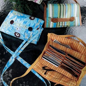 May include: A printed pattern titled "Favorite Things" featuring four different fabric wallet purses. The purses vary in color and design, including floral, striped, and solid patterns. The text "A Wallet Purse" is displayed at the bottom.
