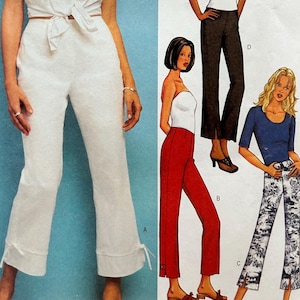 May include: A Butterick sewing pattern featuring a variety of women's pants and tops. The pattern includes a white tie-front top and pants, red pants, black pants, and patterned pants. The pattern number is 3394.