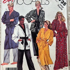 May include: McCall's sewing pattern 2735 featuring robes and pajamas. The cover shows illustrations of various robes in different colors and patterns, including a black and white geometric print and a red paisley design. The size is Large.