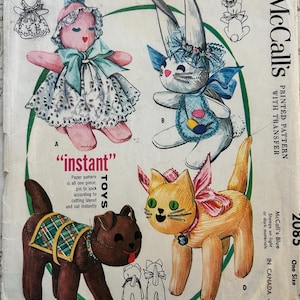 May include: Vintage McCall's pattern for four stuffed sock toys: a doll (8.5" high), a bunny (10" high), a pup (7" high), and a kitty (8.5" high). The pattern includes instructions for instant toys.