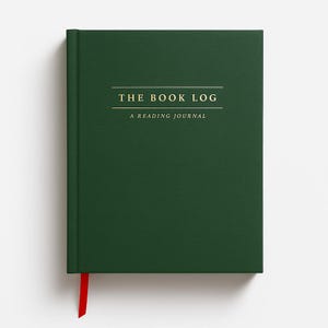 May include: A dark green hardcover reading journal with a red ribbon bookmark. The front cover features gold foil text that reads THE BOOK LOG and A READING JOURNAL, centered between two horizontal lines. The book has a clean, solid finish.