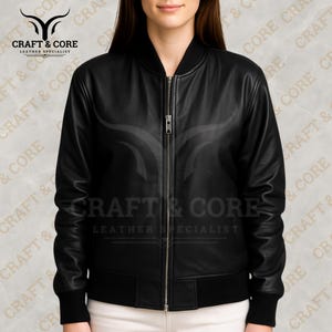 Black Nappa leather bomber jacket for women featuring ribbed collar and cuffs, crafted from 100% genuine leather. Ideal for motorcycling, outdoor activities, and casual wear. png