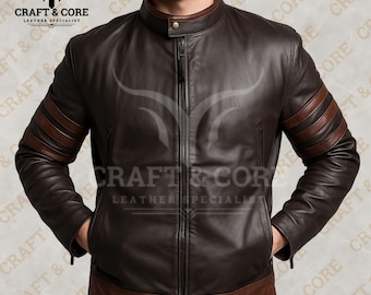 May include: A brown leather jacket with a stand-up collar and a zipper closure. The jacket features brown stripes on the sleeves and a brown trim at the bottom. The brand name "CRAFT & CORE LEATHER SPECIALIST" is visible.
