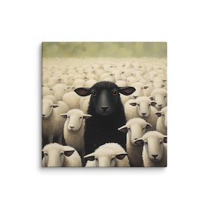 May include: A canvas print featuring a black sheep standing out among a crowd of white sheep. The black sheep is centered, with a dark face and large, dark ears. The background is a soft, blurred green.