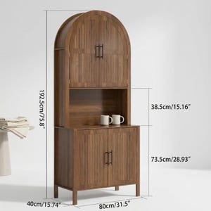 May include: A brown wood cabinet with an arched top, featuring two upper doors and two lower doors with black handles. The unit has an open middle shelf holding two white mugs. Dimensions are 192.5cm/75.8" high, 80cm/31.5" wide, and 40cm/15.74" deep.