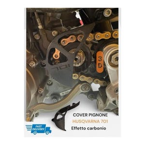 May include: A black motorcycle sprocket cover with a carbon fibre texture, featuring the number 701. The component is shown installed on a Husqvarna 701 engine block with a gold-coloured drive chain. Text on the image includes COVER PIGNONE, HUSQVARNA 701, Effetto carbonio, and 3D.