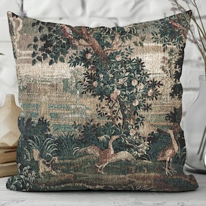 May include: Square cushion with a tapestry design depicting a landscape scene with trees, birds, and water. The colour scheme includes greens, browns, and beige, giving a vintage feel. The cushion is designed for decorative purposes.