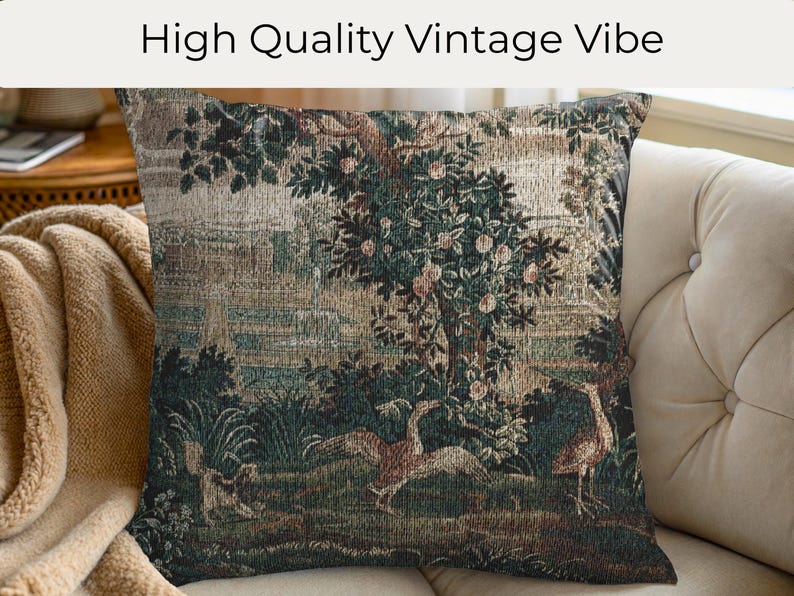 May include: Square cushion with a vintage tapestry design. The cushion features a detailed landscape scene with trees, birds, and foliage in shades of green, brown, and beige. The text "High Quality Vintage Vibe" is at the top.