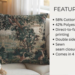 May include: Square cushion with a tapestry design depicting a landscape scene with trees, birds, and water in shades of green, beige, and brown. The cushion is on a beige sofa. Made from 58% cotton and 42% polyester.
