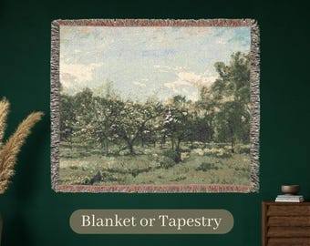 May include: Woven blanket or tapestry featuring a pastoral landscape painting with trees, grass, and a blue sky. The artwork has a vintage aesthetic with a fringed border and the text "Blanket or Tapestry" at the bottom.