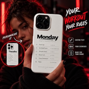 May include: A white smartphone case featuring a black printed workout routine for Monday, including exercises like Push Ups, Dumbbell Rows, Shoulder Press, Bicep Curls, Tricep Extensions, and Plank, with the text "DISCIPLINE BUILDS FREEDOM" at the bottom.