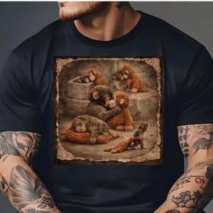 May include: Black t-shirt featuring a detailed graphic of several monkey plush toys in various poses. The image has a vintage, sepia-toned aesthetic, with the monkeys in shades of brown and tan. The design is centered on the shirt.