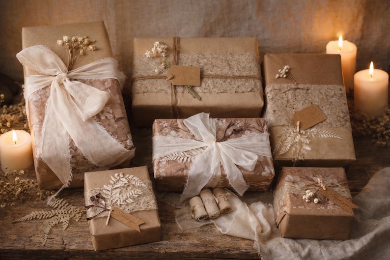 May include: Several wrapped gifts with brown paper and decorative accents. Some are tied with cream-colored ribbons and adorned with dried flowers and lace. Lit candles provide a warm, inviting ambiance. The gifts are arranged on a wooden surface.