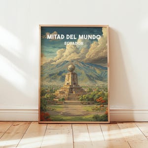 May include: Framed art print featuring a colorful landscape of Mitad del Mundo, Ecuador. The artwork depicts a monument with a globe on top, set against a backdrop of mountains and a cloudy sky. The text "MITAD DEL MUNDO ECUADOR" is displayed at the top.