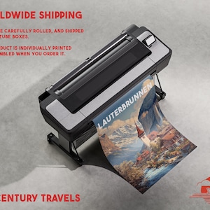 May include: A large format printer is shown, printing a poster with the word "LAUTERBRUNNEN" on it. The poster features a scenic view of a mountain village. The image also includes the text "MIDCENTURY TRAVELS".